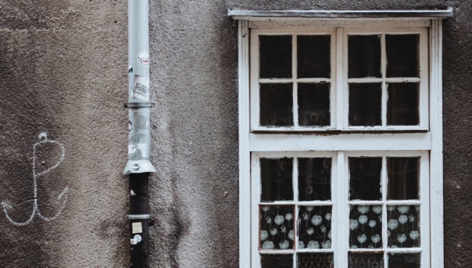 Warsaw Uprising symbol (the anchor) on a house wall in Warsaw, Poland